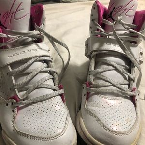Girls pink, white, and black Jordan high tops
